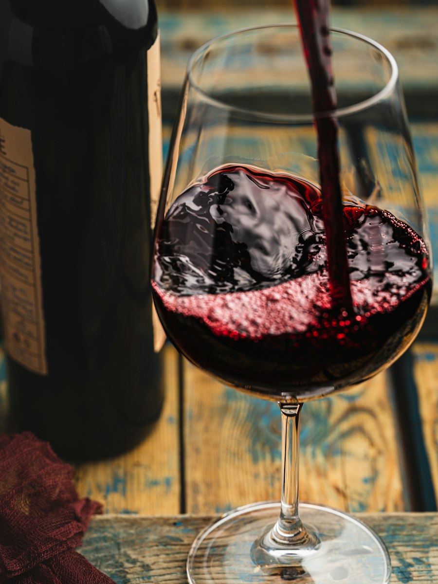 Red wine being poured into a glass